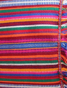Brightly coloured woven textile
