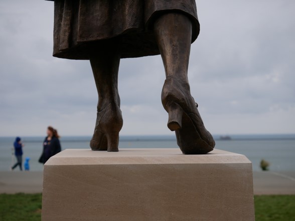 close up of feet of Nancy Astor statue on Plymouth hoe