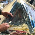 An old umbrella painted with a stormy sea scene