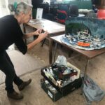 A woman arranges the art exhibition