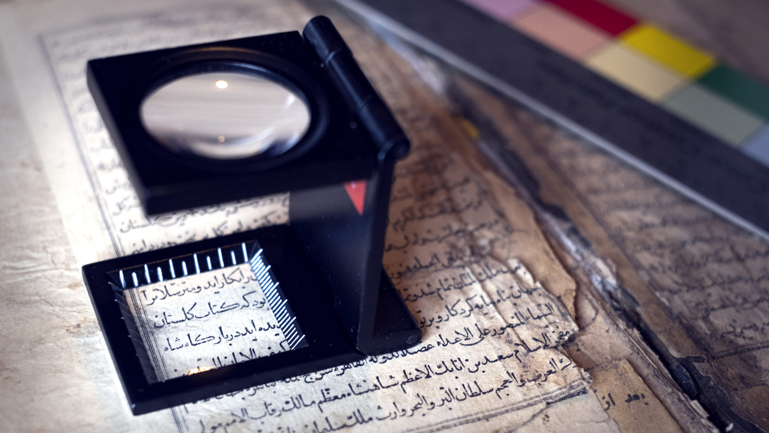 Arabic script and magnifying glass