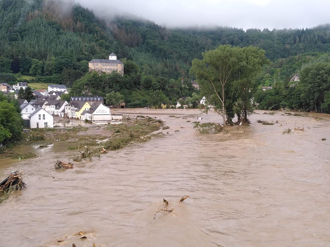 Buildings and trees in the Ahr Valley in Altenahr, Germany devasted by flooding in July 2021.