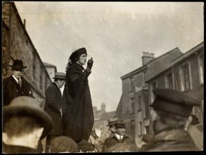 Nancy Astor speaking to a crowd of men