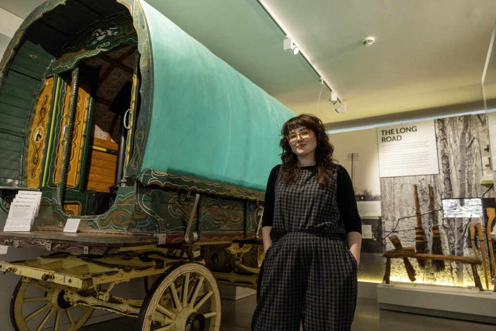 Woman standing in front of wagon