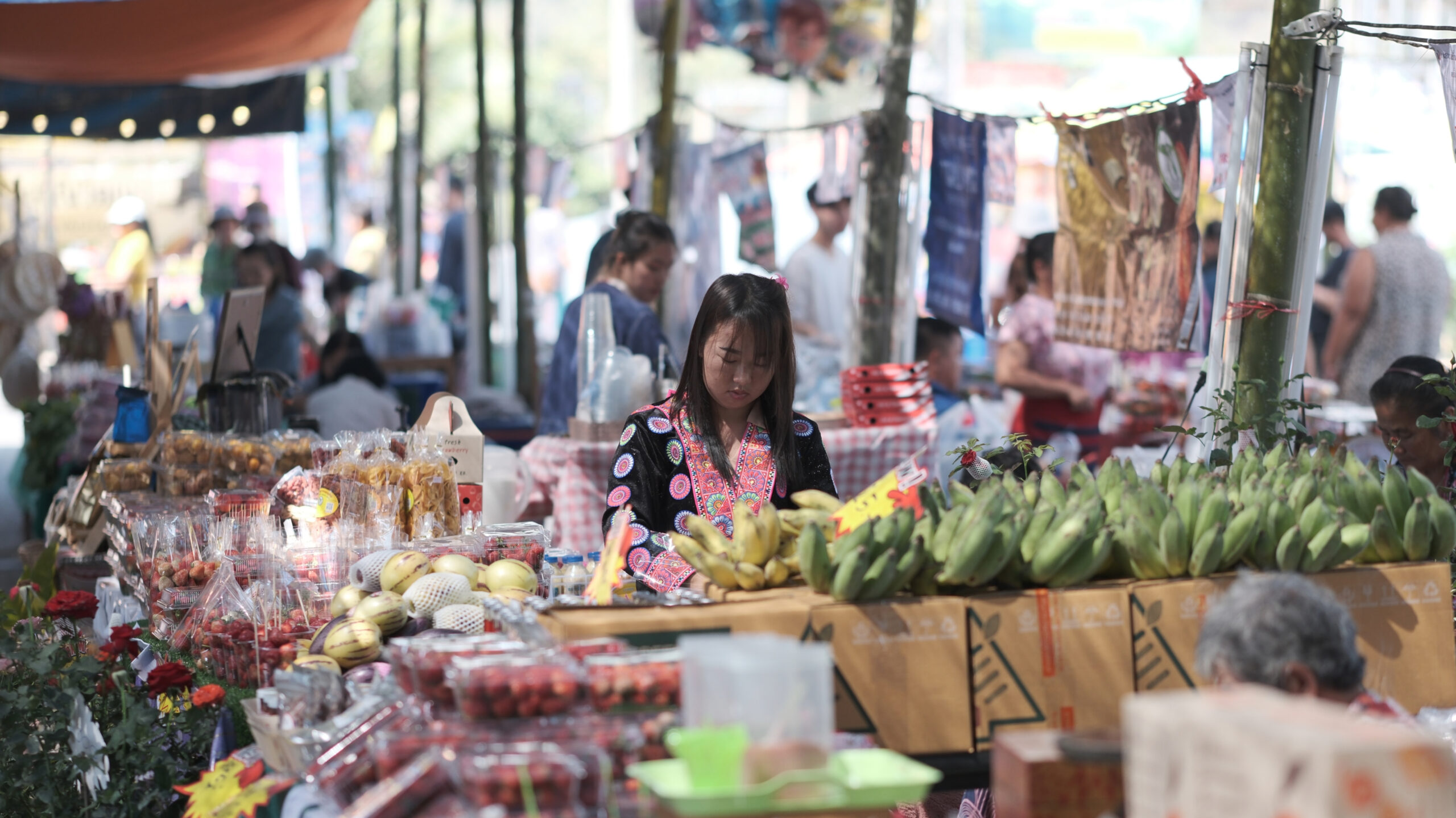 Female consumer in a market in Thailand.
