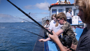 Young people in Plymouth on a fishing trip to explore experiential food system learning as part of the FoodSEqual project. Photo: Jim Baldwin/Fotonow CIC.