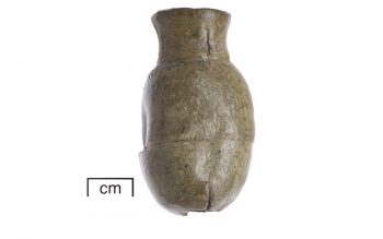 Pilgrim souvenirs excavated at Glastonbury: an ampulla holding holy water (© Glastonbury Abbey; photograph: David Cousins)