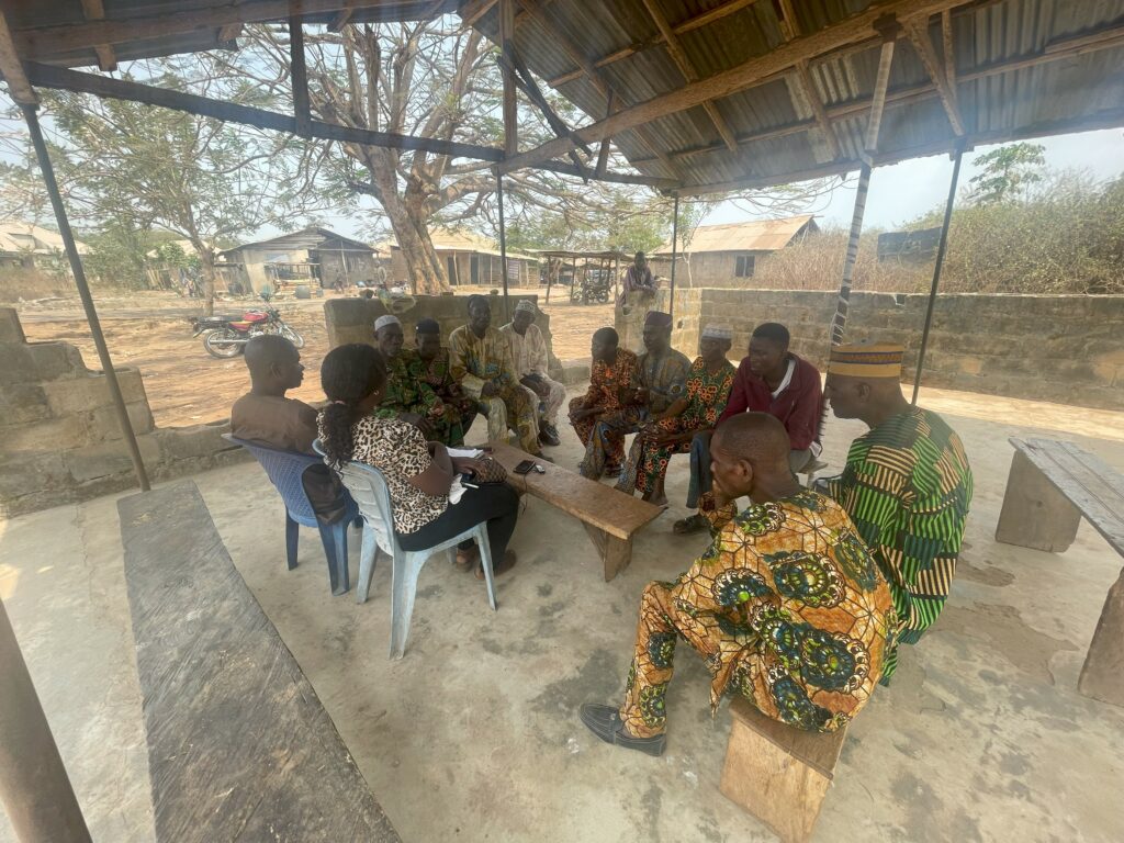 Abiola with men focus group discussion