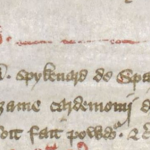 Medieval manuscript extract in red and black ink.