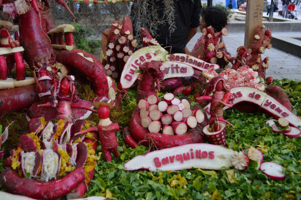 a decorative display of carved radishes where the red skin contrasts with the white interior