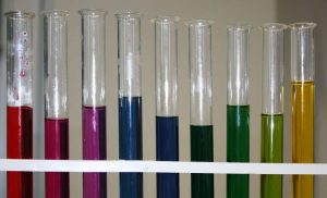a series of test tubes of coloured solutions from red through blue to yellow