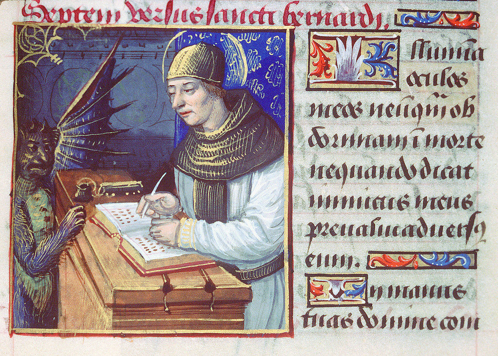 Titivillus is a demon said to introduce errors into the work of scribes. This is a 14th century illustration of Titivillus at a scribe's desk set within handwritten script.