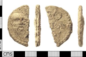 Post-Medieval cast lead or lead-alloy papal bulla of Pope Leo X (AD 1513-1521). Full description at https://finds.org.uk/database/artefacts/record/id/522639