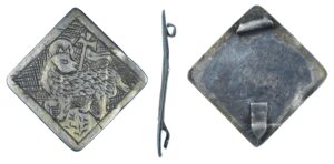 Silver reliquary pendant, dating to the later medieval period (c.AD1300-1500), later converted for use as a badge. Full description at https://finds.org.uk/database/artefacts/record/id/992821