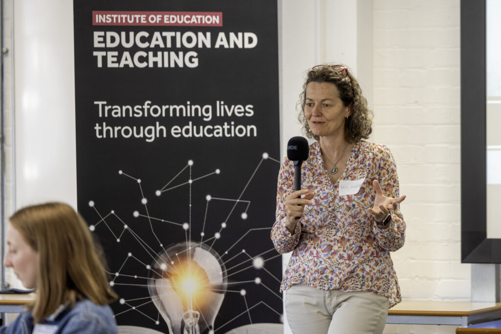 Woman speaking to a group with a microphone