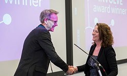 Sally-Lloyd Evans receiving her award from Phil Newton (Research Dean for the Environment)