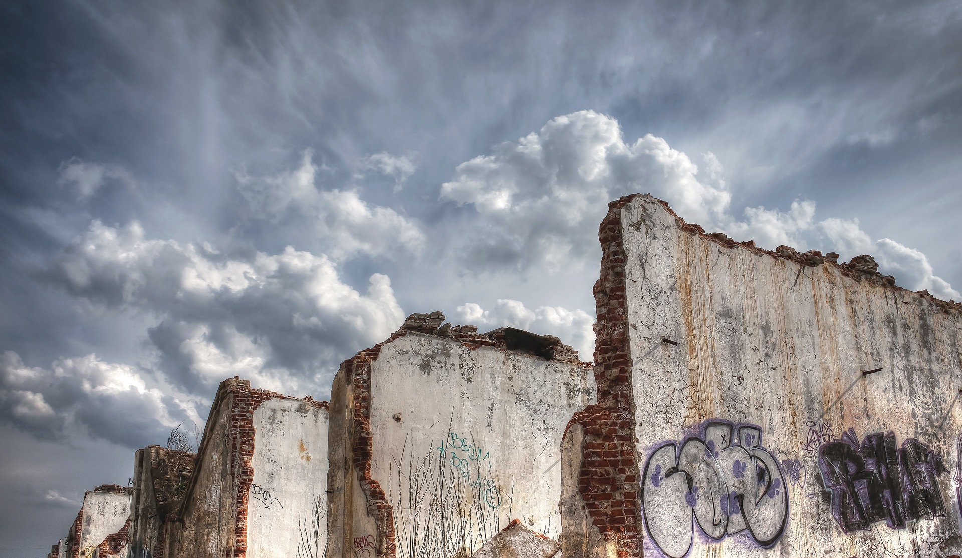ruined brick walls with graffiti
