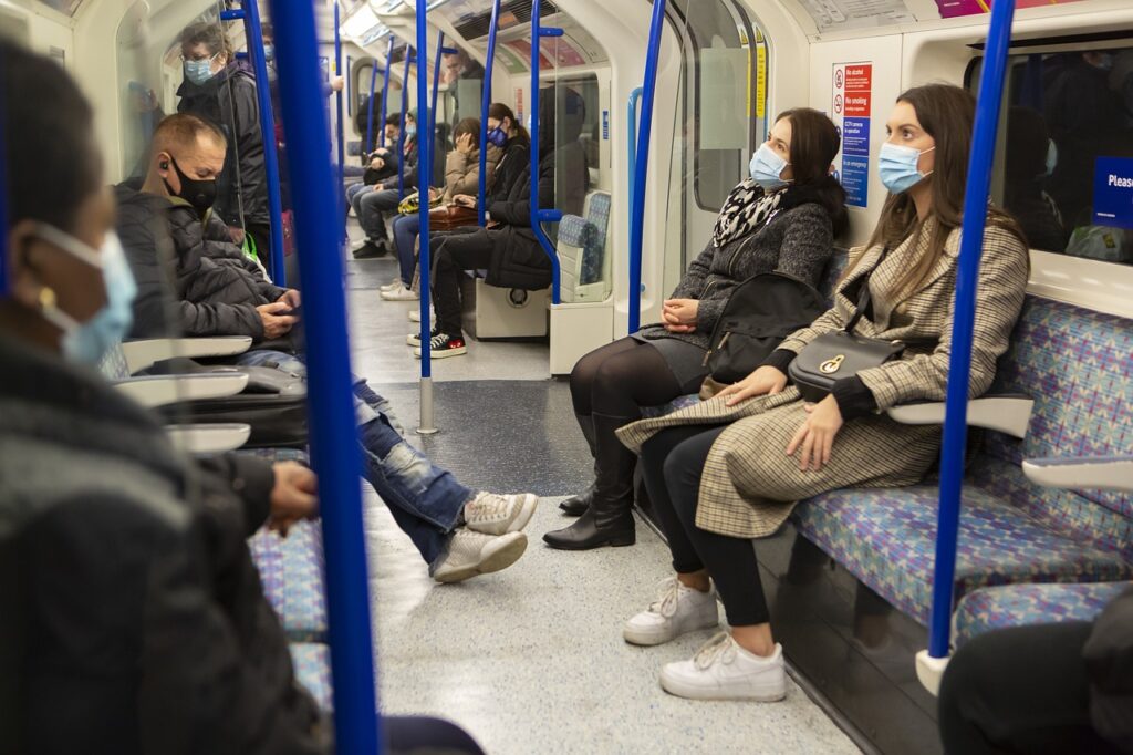 People wearing face masks on the London underground