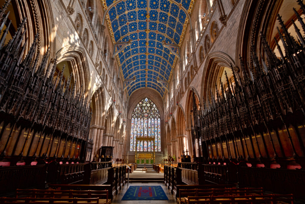 Inside the choir of Carlisle Cathedral, UK, looking east to the high altar. The 19th-century starry ceiling is visible.