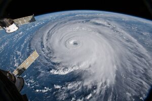 A hurricane viewed from space - the curvature of the Earth and parts of the ISS can be seen
