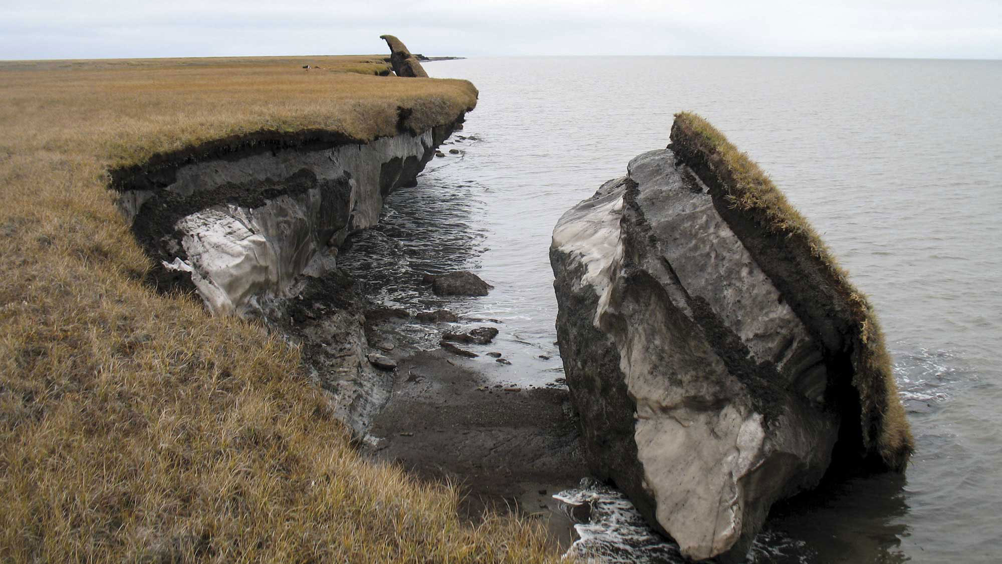 A collapsed section of melting permafrost that has fallen into the ocean.