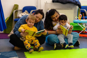 two-women-reading-to-children