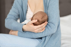 woman breastfeeding her baby