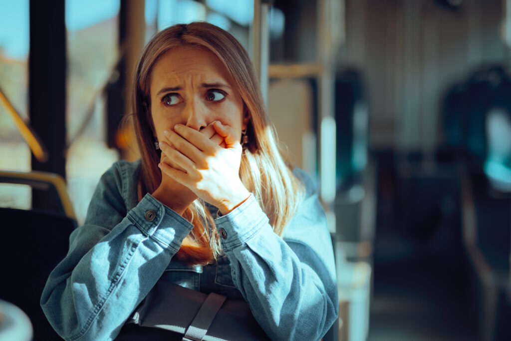 Woman Travelling by Bus Feeling Motion Sickness
