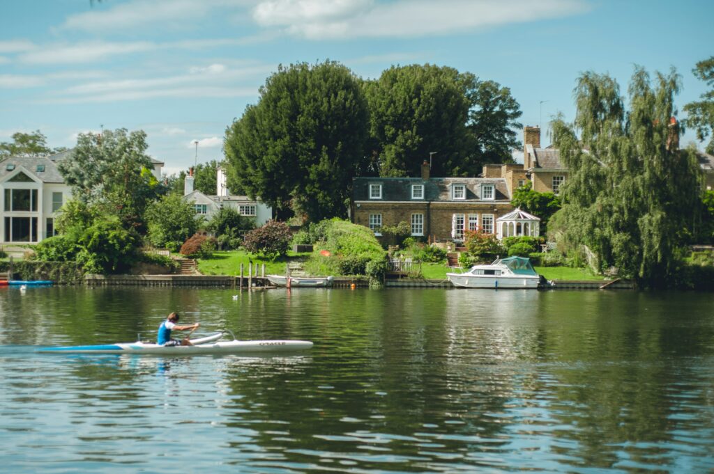 A rower on an affluent part of the River Thames