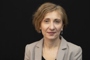 Photograph of Prof Vesna Stojanovik in front of a black background
