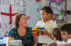 teacher and pupil speaking to each other